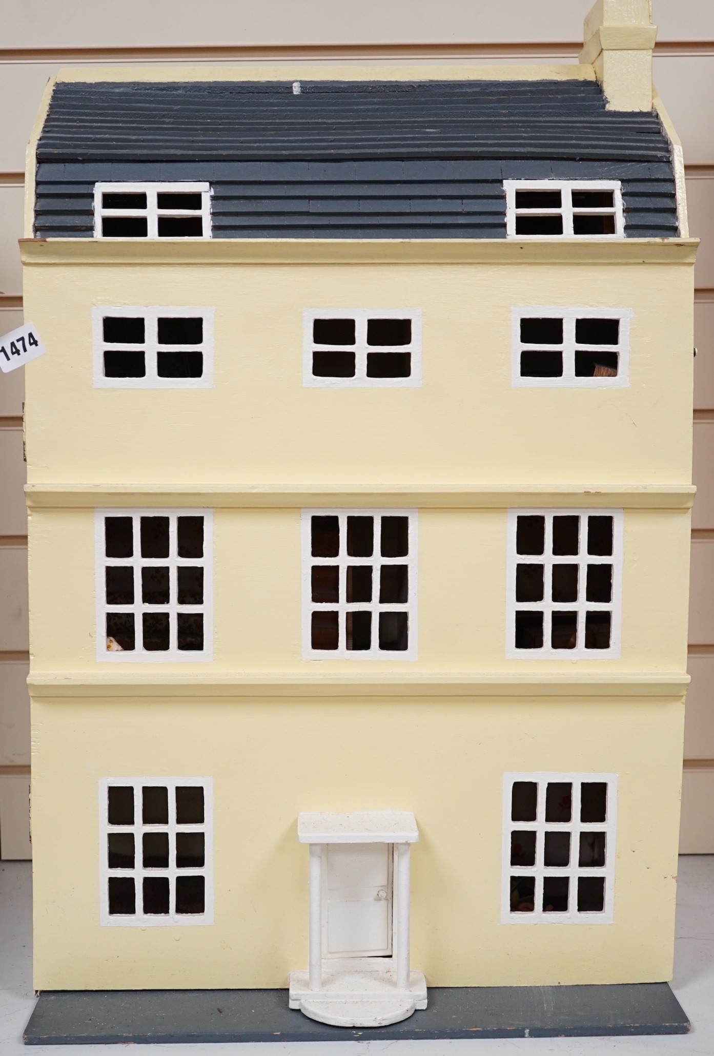 A doll's house based on a Georgian Bath townhouse, with contents, 43cm wide, 71cm high